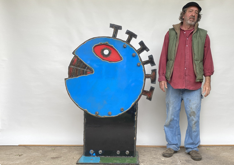 John Martini and one of his sculpture